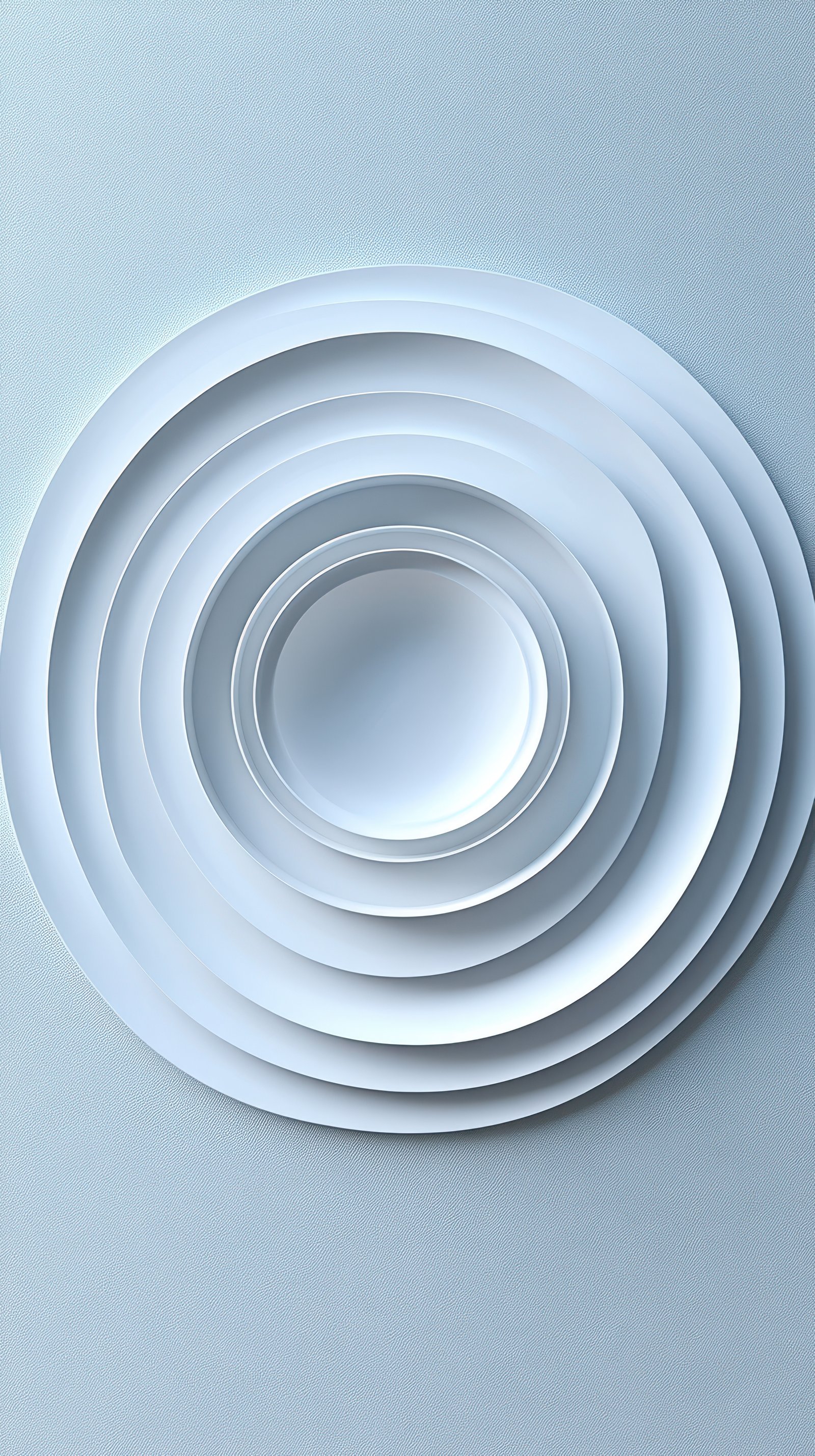 Unique arrangement of white circular plates displayed on a light background showcasing minimalist design and harmony
